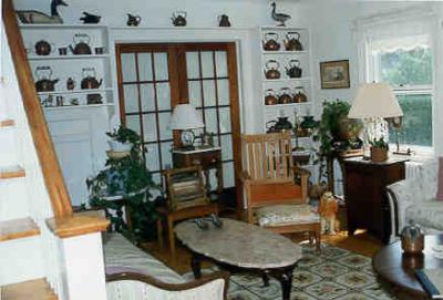 Sitting rooms and guest quarters are furnished in Victorian antiques.