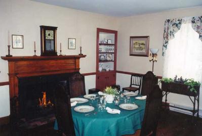 Original fireplaces and original floorboards. This is our dining area.