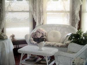 Antique Wicker set in front of the bay windows.  Who wants to leave?
