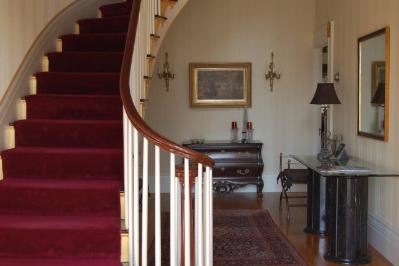 The grand sweeping staircase in the entryway hall.